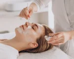 cosmetologist-doing-face-treatment-applying-face-mask_1303-28042_8_11zon